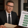 Oklahoma criminal defense attorney in a law office reviewing Lean Six Sigma process charts, illustrating The Urbanic Law Firm’s data-driven approach to managing criminal cases.