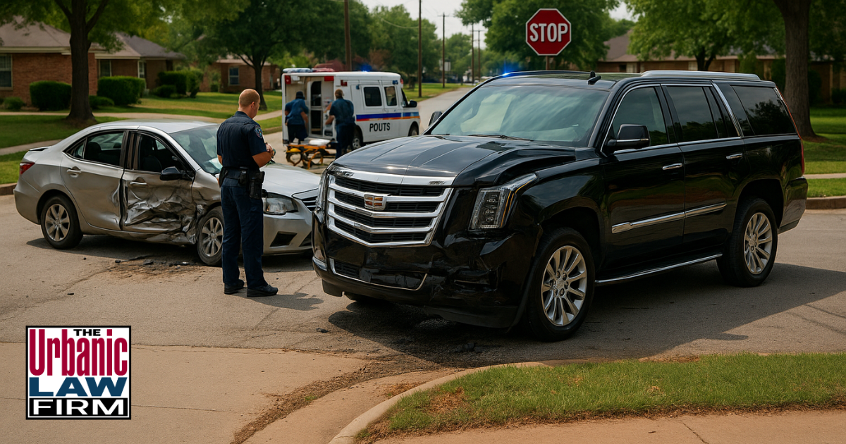 Daytime Oklahoma residential crash scene with damaged Escalade-style SUV and small car, police and paramedics responding to serious DUI great bodily injury case for Urbanic Law Firm