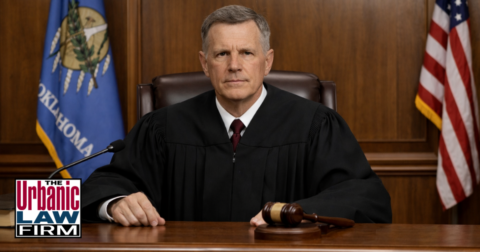 Oklahoma judge seated at his bench in a courtroom, representing stalking defense in Oklahoma and criminal defense by The Urbanic Law Firm.