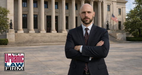Attorney standing outside an Oklahoma courthouse, illustrating Oklahoma incest defense and criminal defense representation by The Urbanic Law Firm.