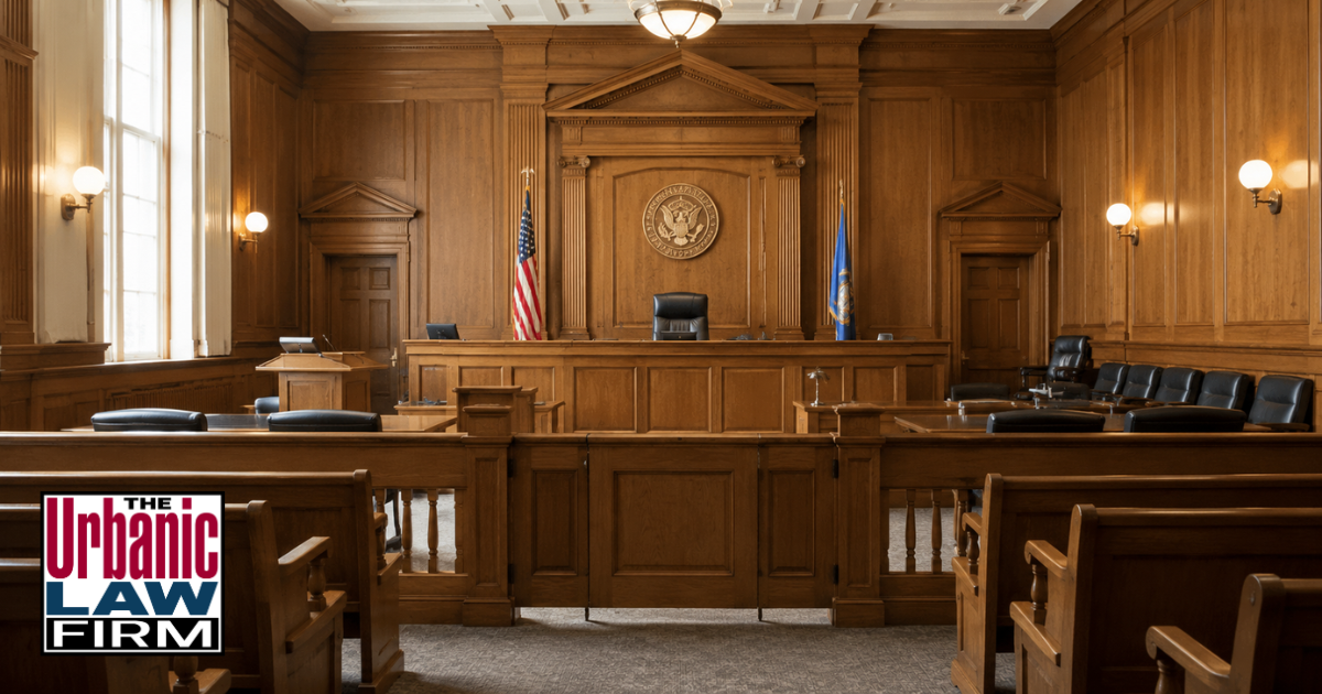 Empty Oklahoma courtroom for Oklahoma child endangerment criminal defense content by The Urbanic Law Firm, showing the judge’s bench, jury box, and polished wood interior with no people present.
