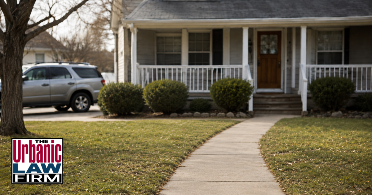 Daytime view of a suburban home and front walkway representing Oklahoma child neglect criminal defense by The Urbanic Law Firm.