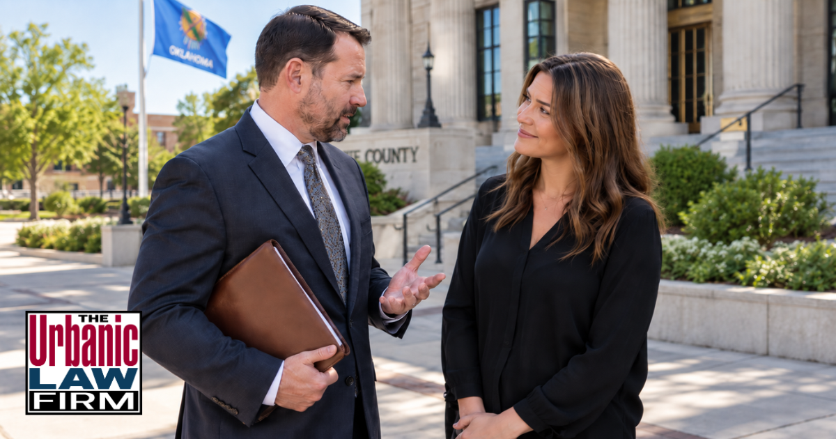 Oklahoma DUI-Drugs defense client speaking with a criminal defense attorney outside a courthouse, representing The Urbanic Law Firm’s defense of Oklahoma DUI-drugs charges.